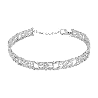 Silver bracelet with intricate design on a white background